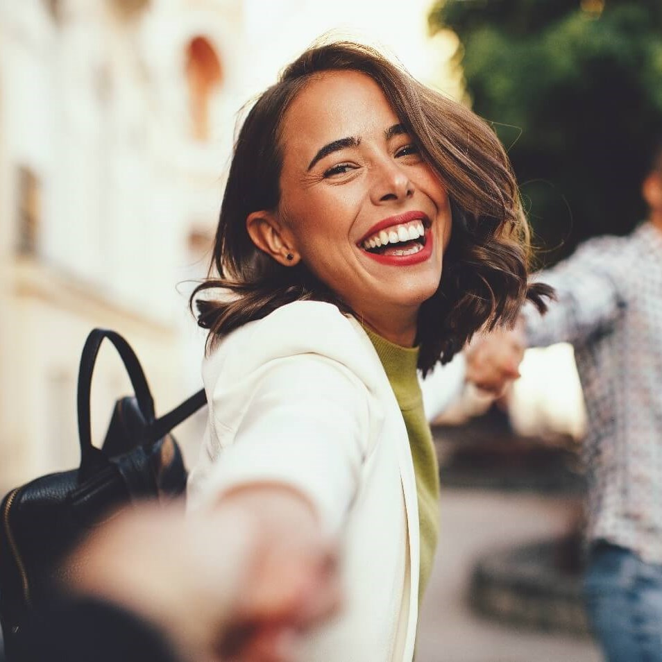 Woman reaching out and laughin